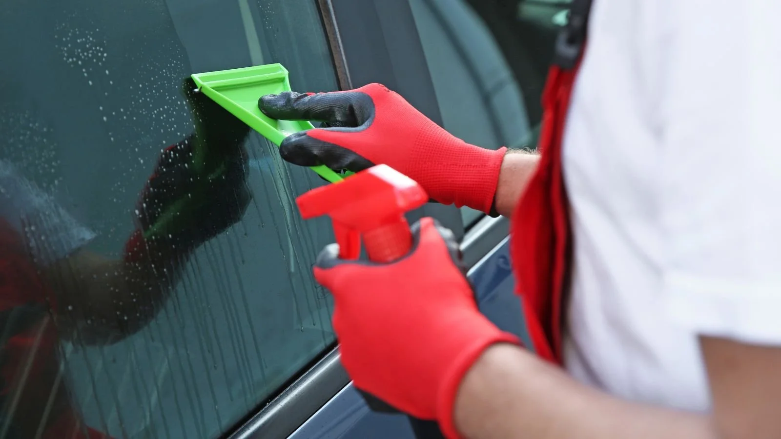 Professional window cleaning before a mobile tinting service