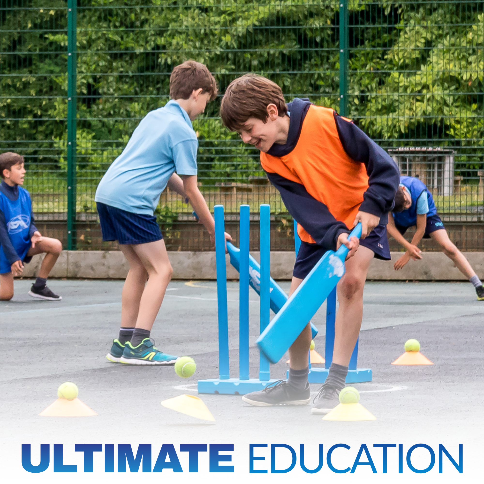 Children participating in an outdoor sports activity, using cones and a small blue ramp on a court, with trees and a fence in the background.