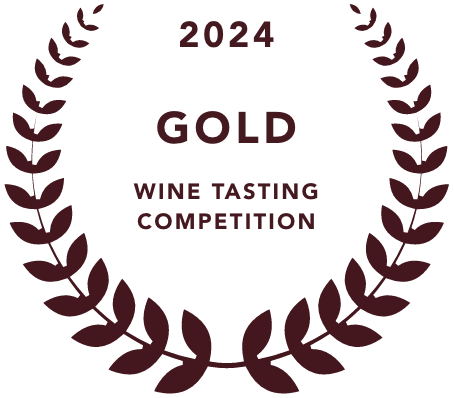 Gold medal emblem with laurel wreath for 2024 Wine Tasting Competition, positioning Mala Mía Mezcal among the best mezcal brands.