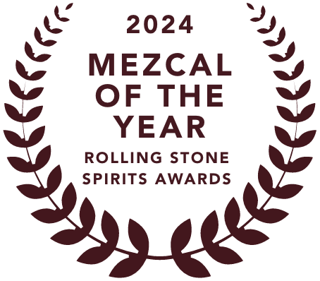 Emblem for 2024 Mezcal of the Year Rolling Stone Spirits Awards, making mala mía mezcal one of the best mezcal brands, featuring a laurel wreath and text in dark purple.
