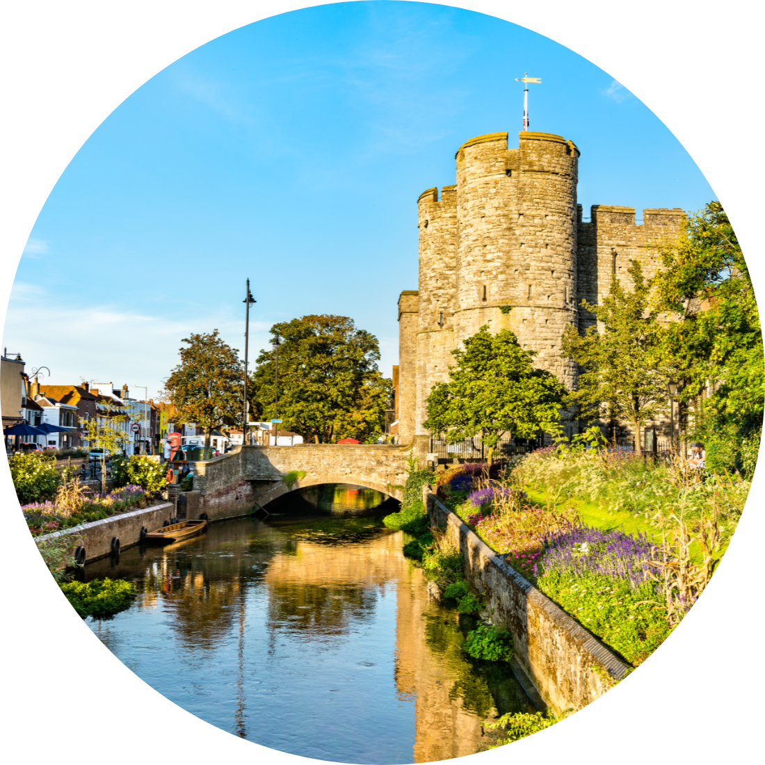 Local taxis, Westgate Towers on the Stour, colourful trees, and Canterbury under a blue sky.