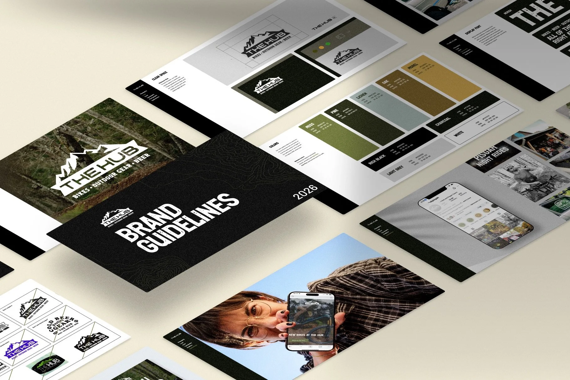 A branding guide layout for 'The Hub' featuring various logos, color palettes, and marketing materials for a bike and outdoor gear company, displayed on a white table.