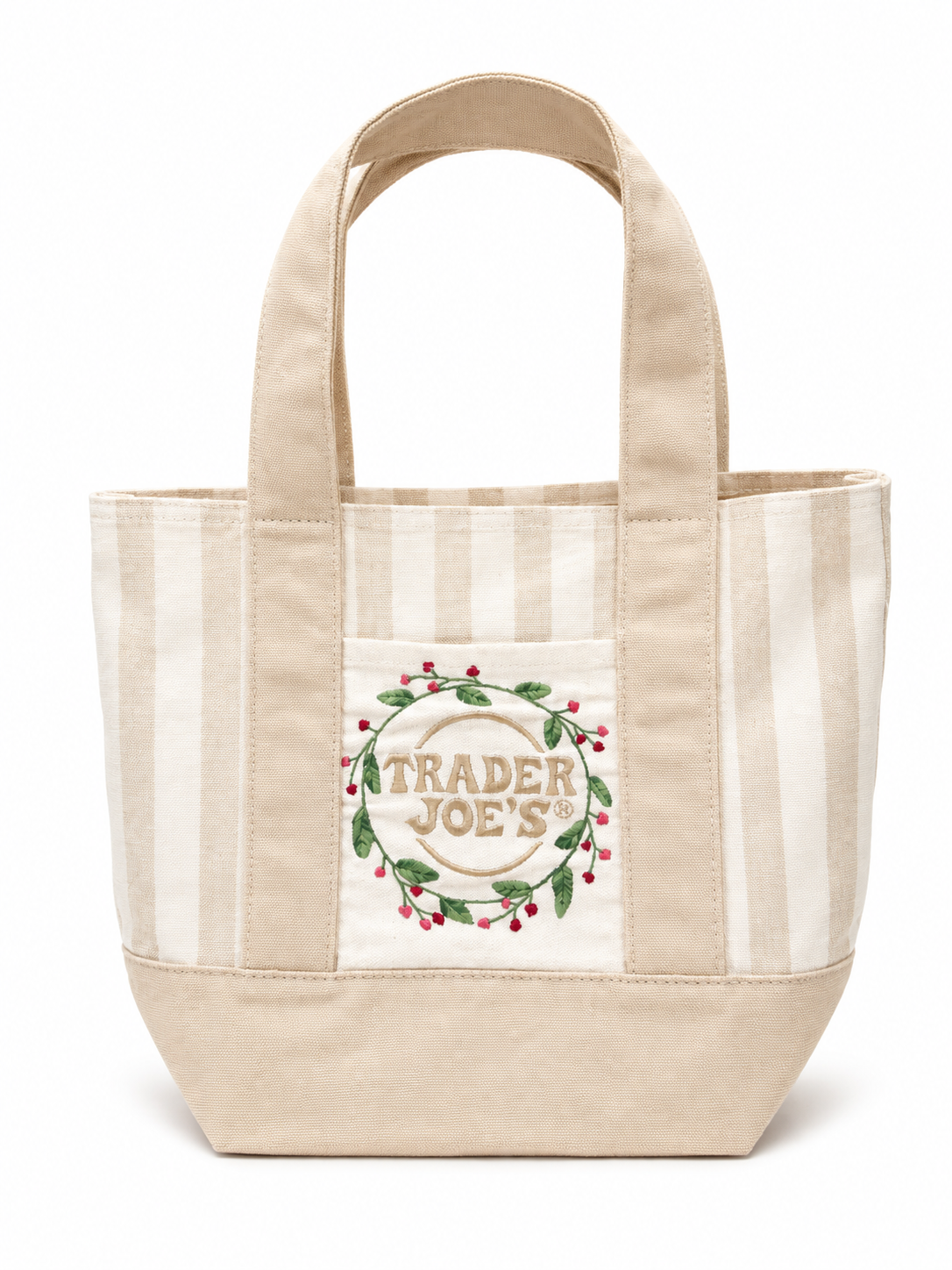Beige and cream striped tote bag with Trader Joe's logo and a wreath of green leaves and red berries on front pocket.