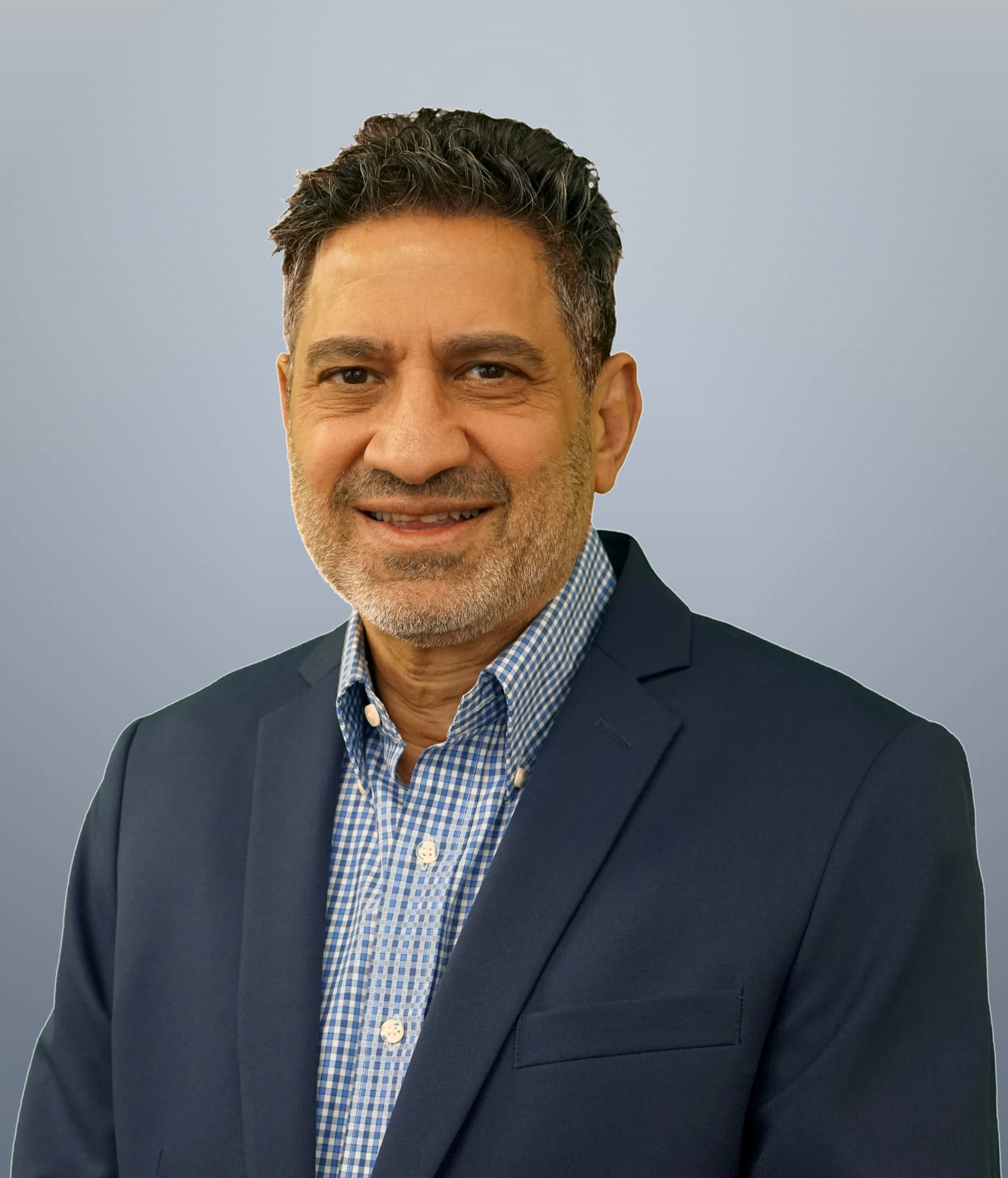Professional headshot of Operation Serve International's Executive Director, Sameh Sadik