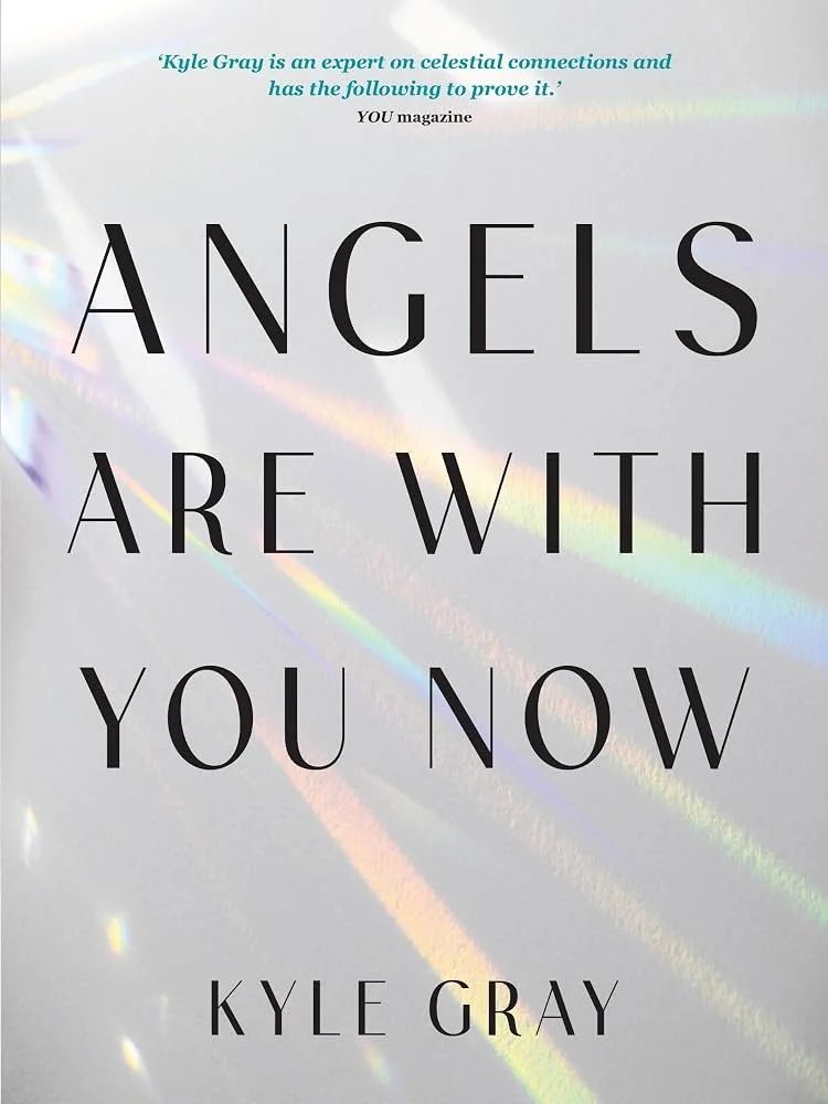 Book cover titled "Angels Are With You Now" by Kyle Gray, with a background of iridescent rainbow light streaks on a pale surface.