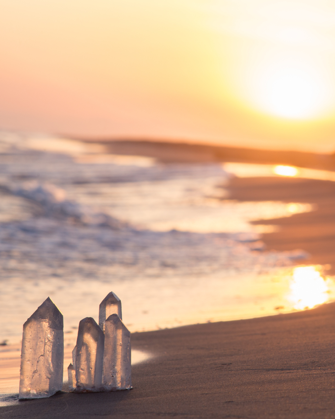 Crystal formations on the sandy beach at sunset