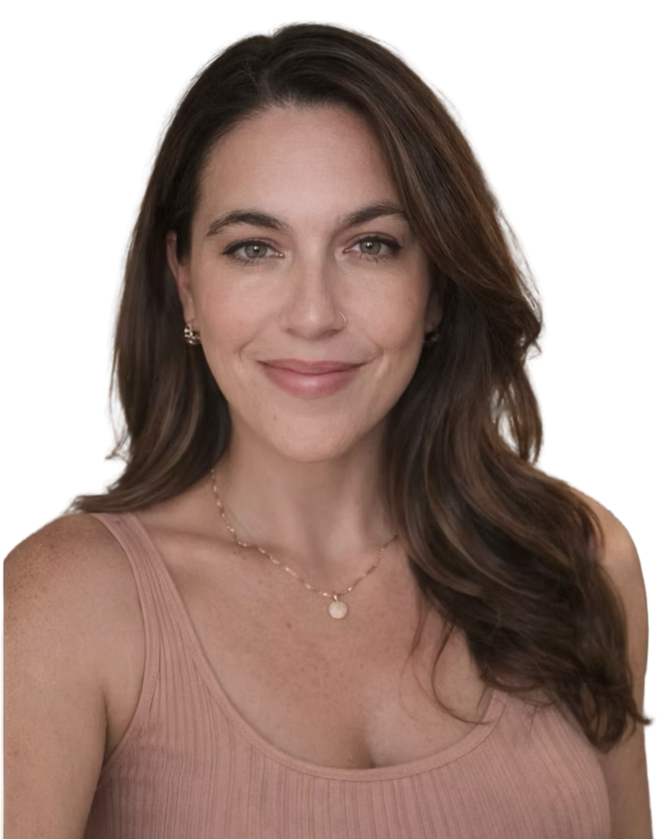 A woman with long wavy brown hair, grayish-green eyes, and a light skin tone is smiling slightly. She is wearing a light pink sleeveless top, a thin gold necklace with a small pendant, and small earrings. The background is plain and dark.