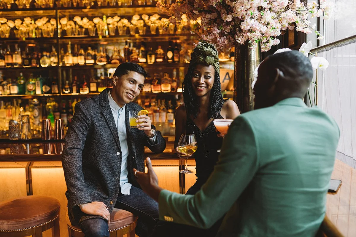 Guests enjoying cocktails in an elevated bar experience captured for commercial hospitality marketing boutique nyc hotel.