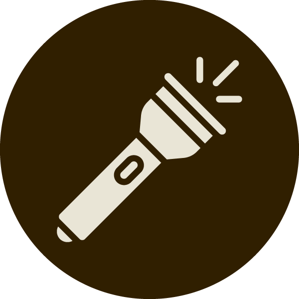 A flashlight turned on, emitting light.