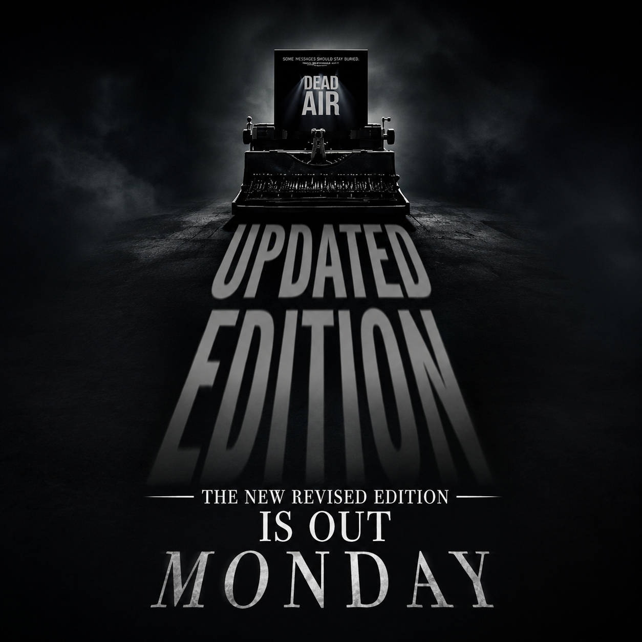 A typewriter on a dark surface projecting the words "Updated Edition" and "Is Out Monday" with a poster reading "Dead Air" in the background.