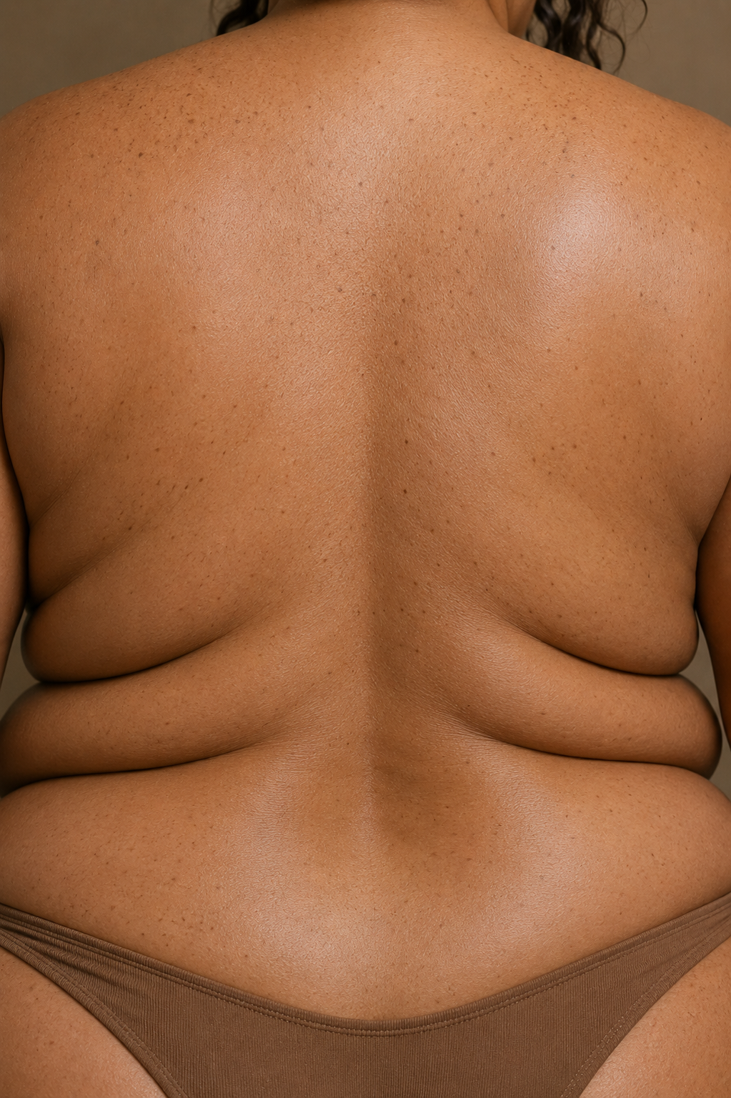 Close-up of natural back skin and visible skin texture representing inclusive professional body waxing services.