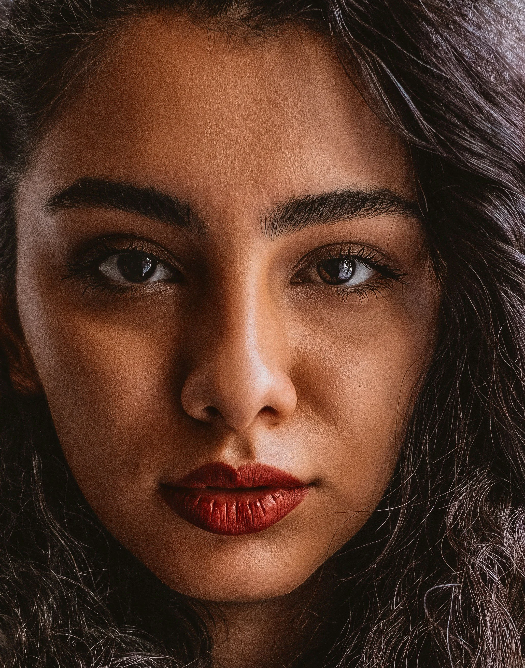 Close-up beauty portrait highlighting smooth, radiant skin after a face wax.
