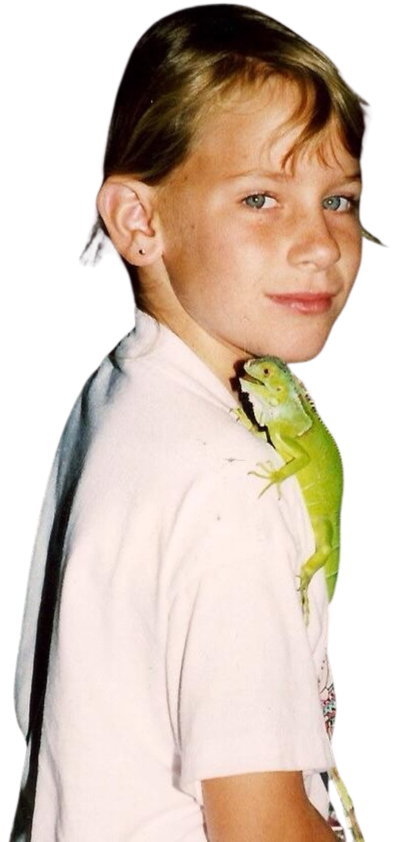 Young Cindy Derby as a child, pictured with a small green lizard perched on her shoulder.