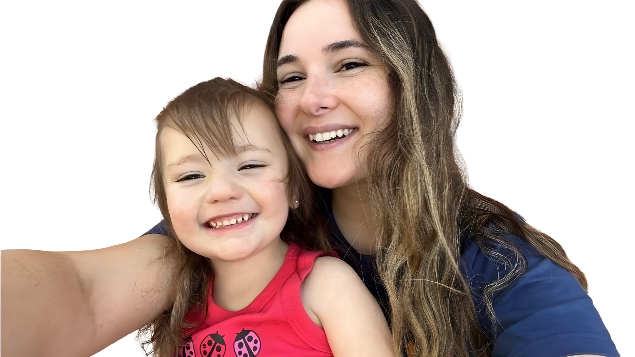 A woman and a young girl smiling and hugging, taking a selfie together.