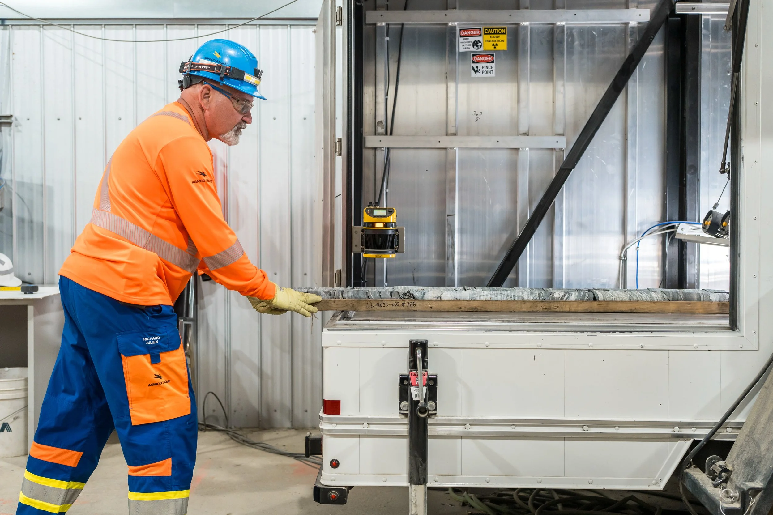    AI-Driven Core Scanning   : A technician prepares drill core samples for automated multi-sensor analysis inside a mobile scanning trailer at Agnico Eagle’s Goldex operation in Quebec, Canada. (Photo: Agnico Eagle Mines Limited)  