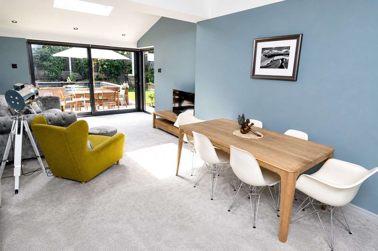 Completed open-plan home extension in Wirral with dining and living area overlooking the garden