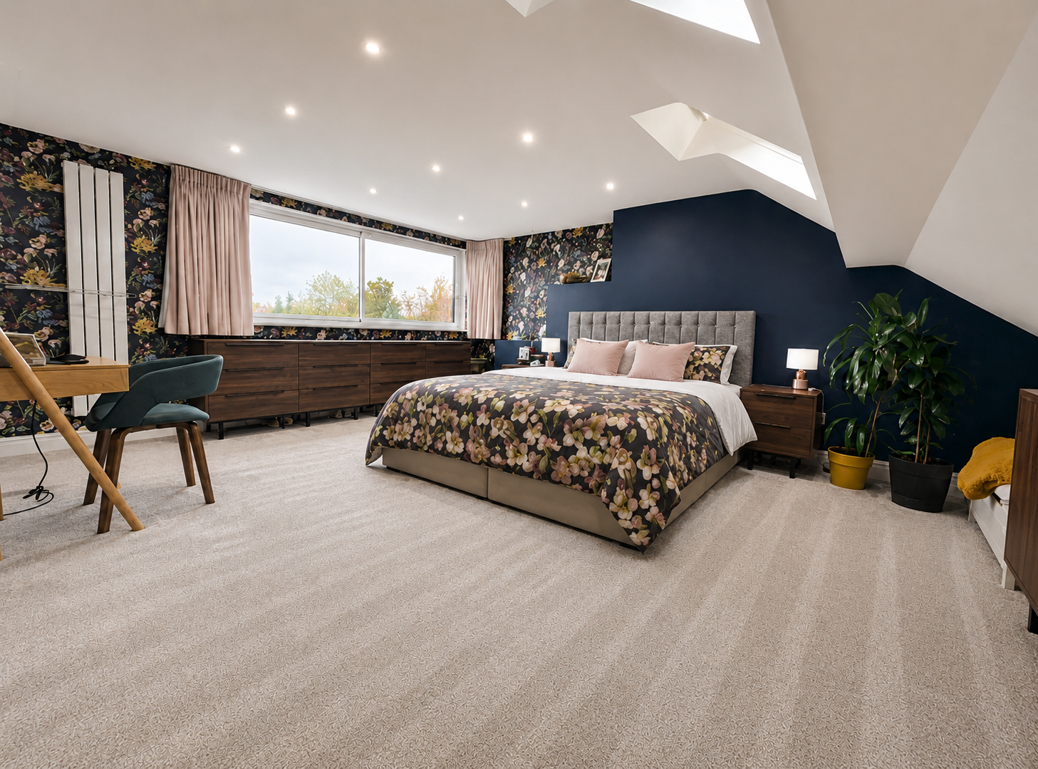 Bespoke loft conversion bedroom with feature wall, roof window and fitted storage