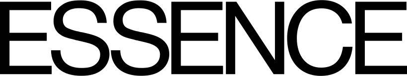 Black guitar with a blue strap and gold hardware on a dark background.