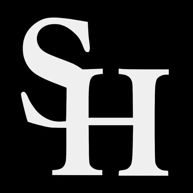 Black background with large white overlapping letters 'S', 'H', and 'I'.