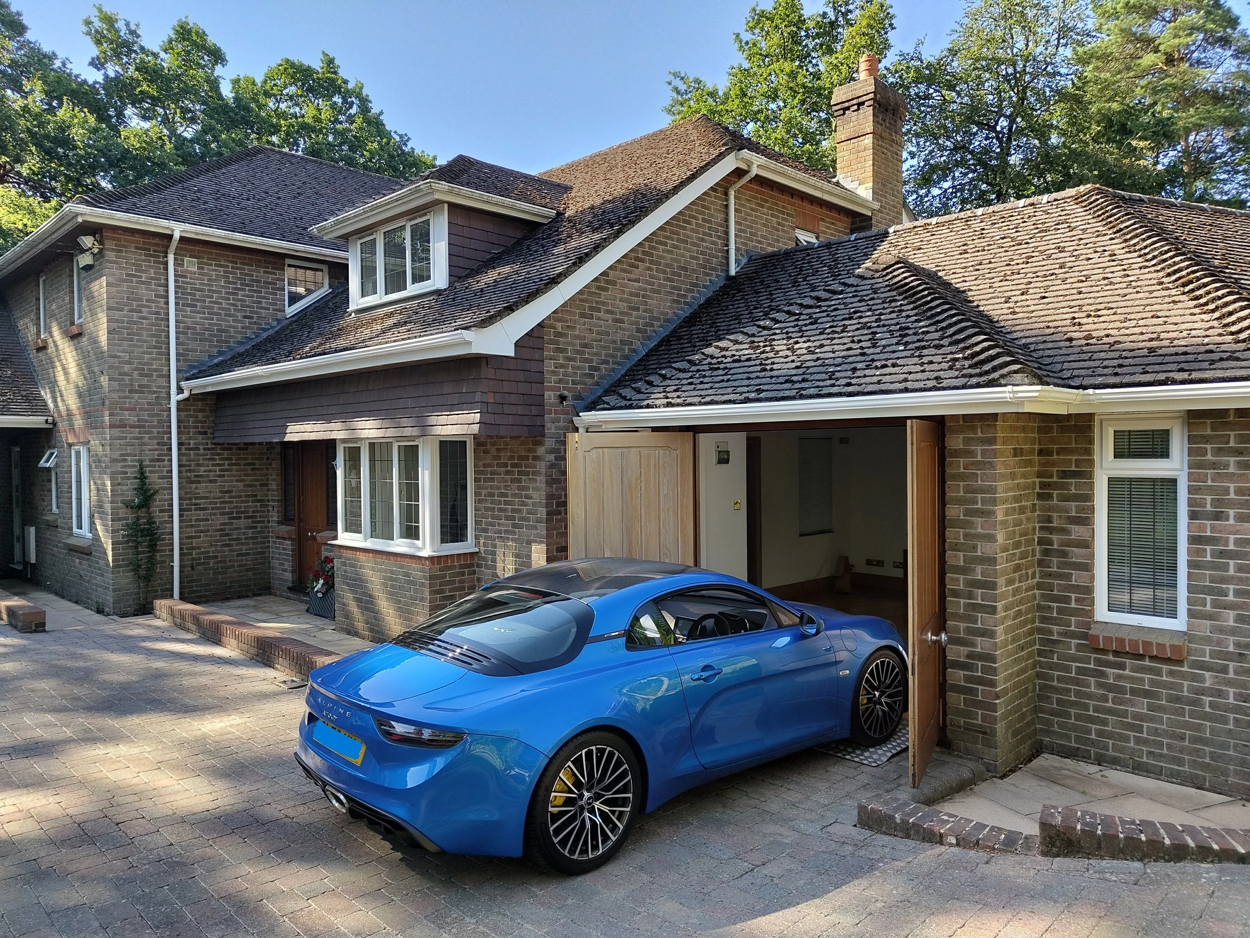 house featuring internal garaging and storage