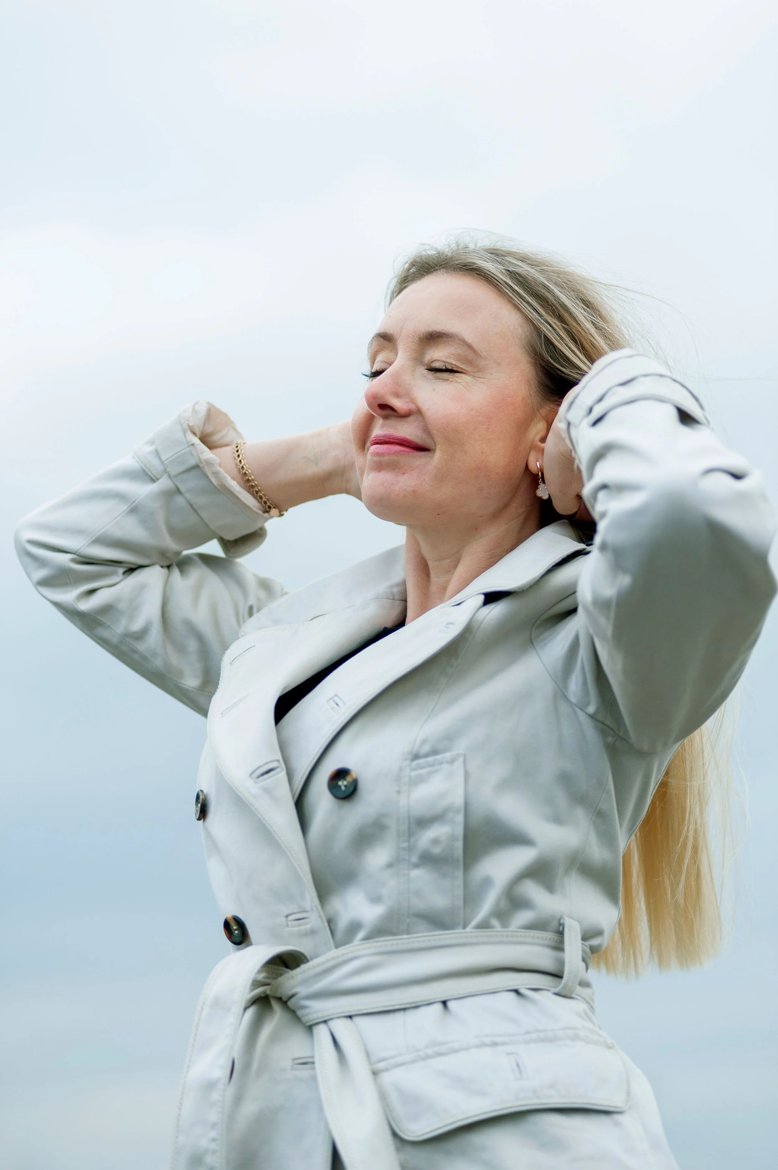 A woman feeling good enjoying being outside after anxiety and depression therapy.