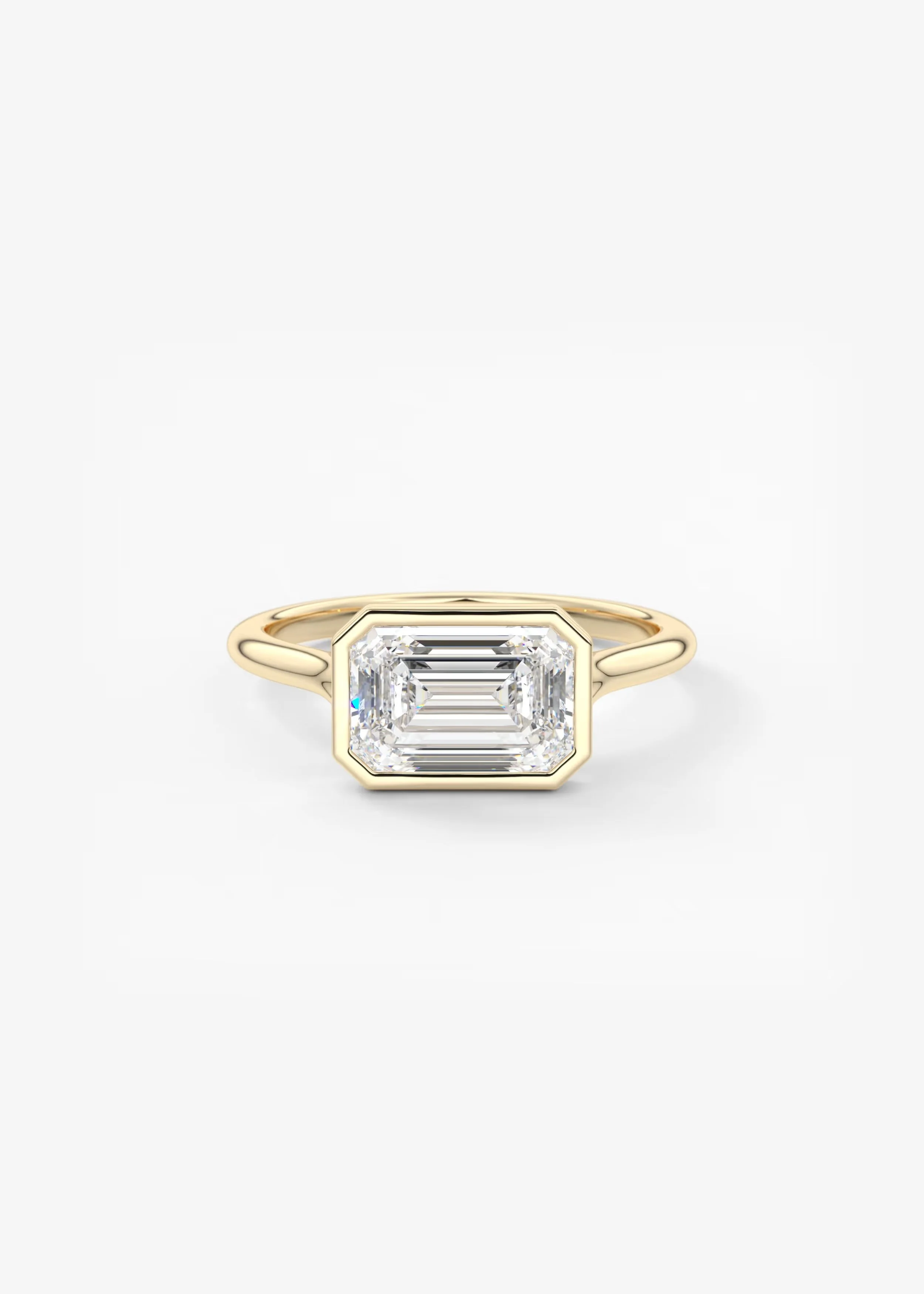 Ein eleganter Ring mit einem großen, hänfelförmigen Diamanten in einer edlen Fassung auf einem weißen Hintergrund.