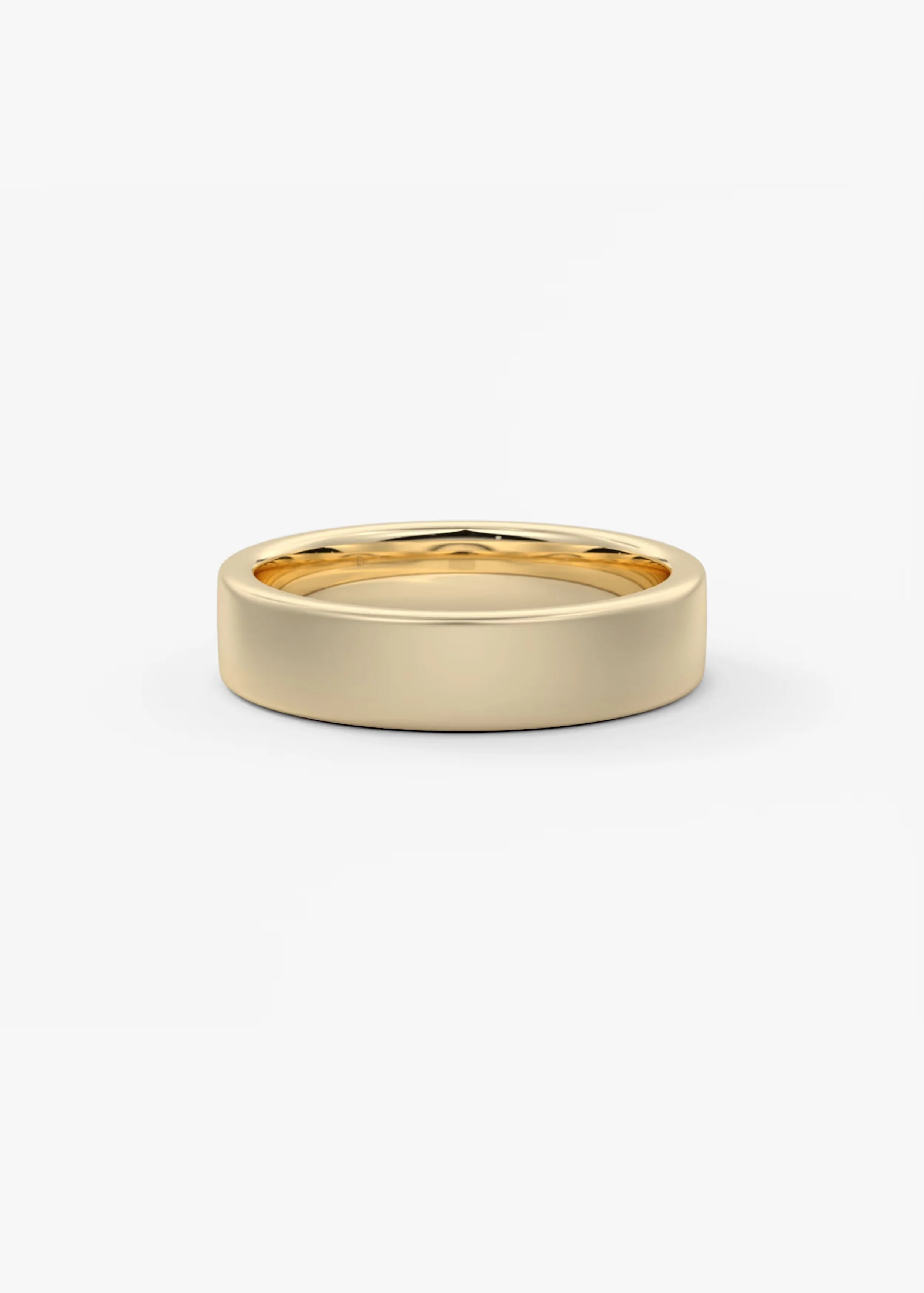 Ein goldener Ehering auf weißem Hintergrund.