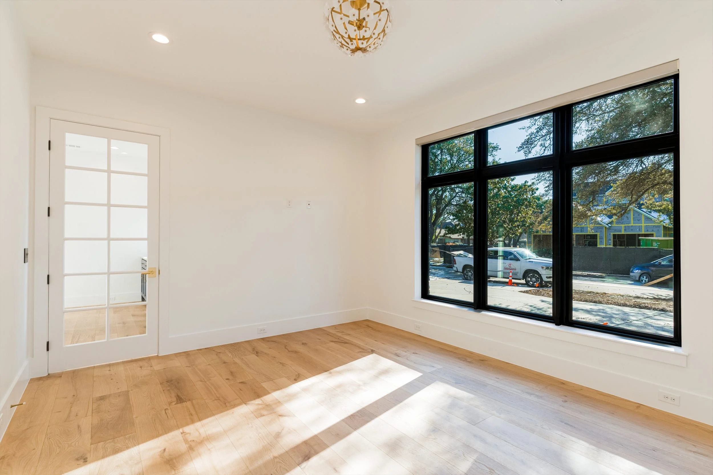 Bedroom with black framed windows at 13510 Crestmoor Dr.