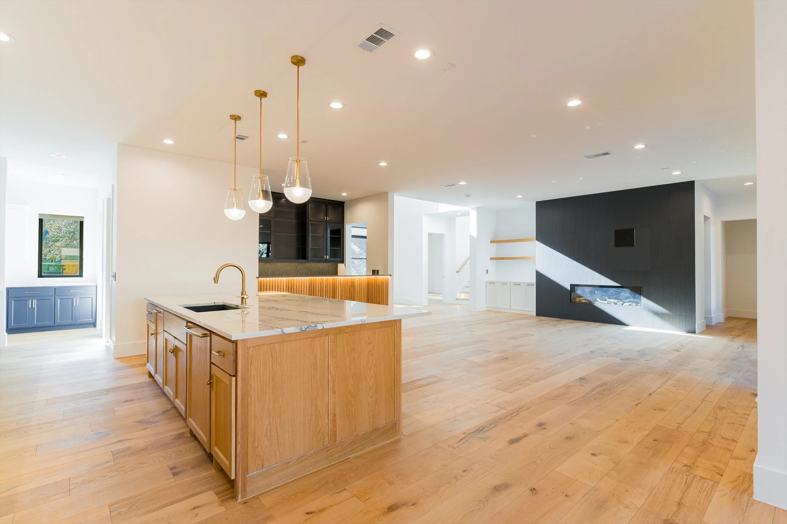 Kitchen island and living area at 13510 Crestmoor Dr.