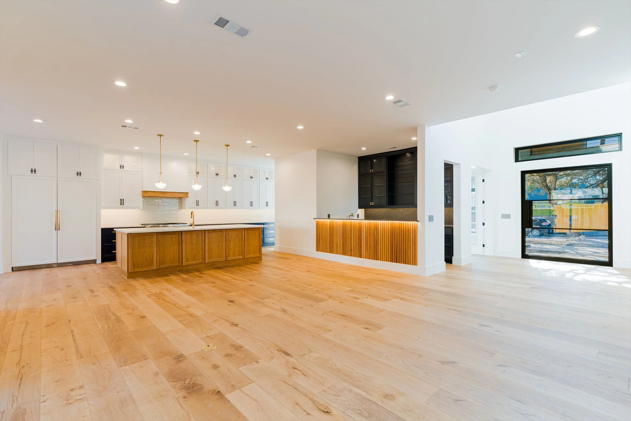 Open kitchen with black accent fireplace at 13510 Crestmoor Dr.