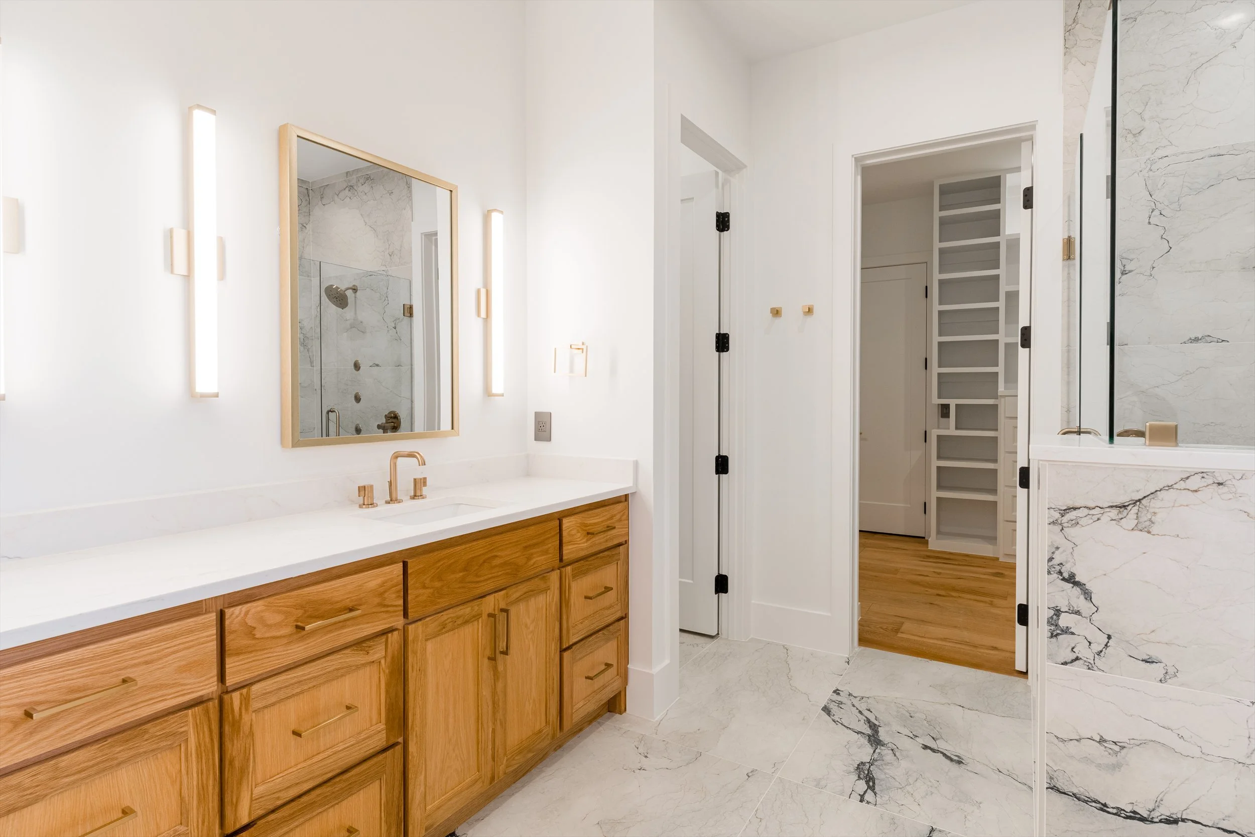 Primary bathroom double vanity at 13510 Crestmoor Dr.