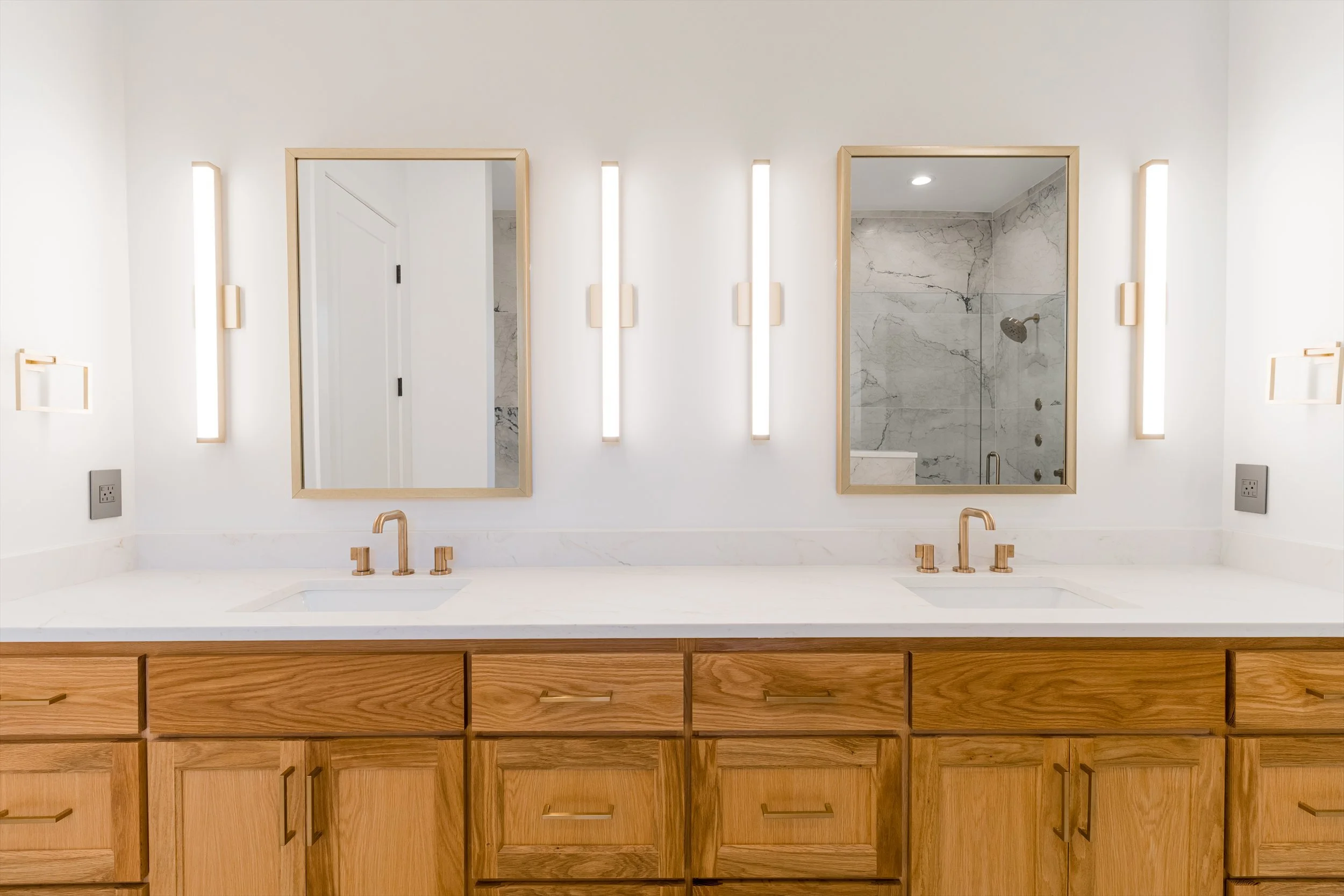 Primary bathroom double vanity detail at 13510 Crestmoor Dr.