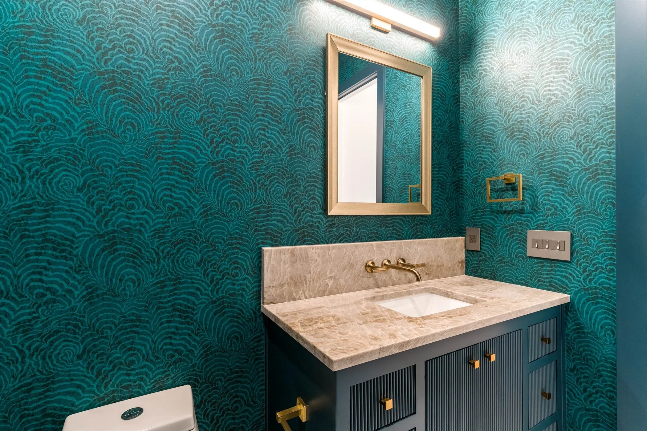 Teal powder room vanity at 13510 Crestmoor Dr.