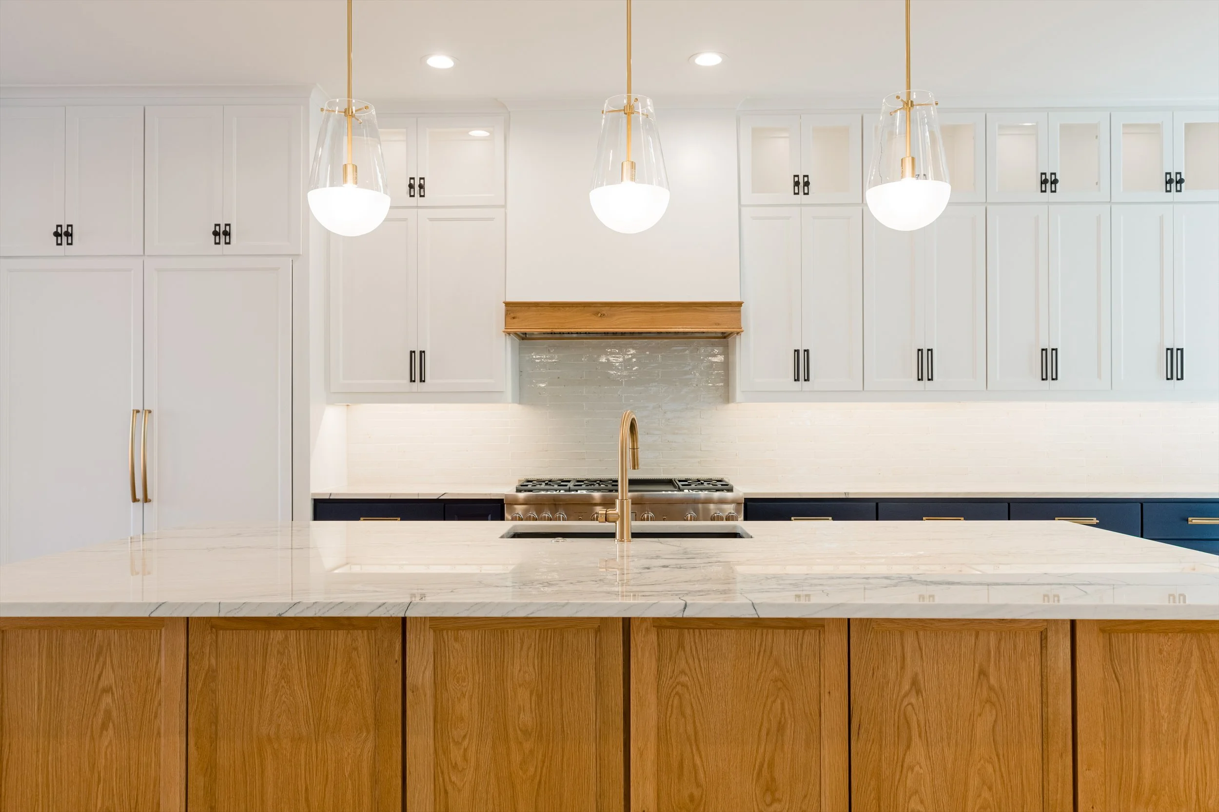White and natural wood kitchen at 13510 Crestmoor Dr.