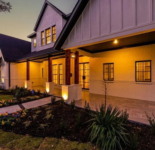 Evening front exterior of 13640 Littlecrest Dr custom home in Farmers Branch, Texas