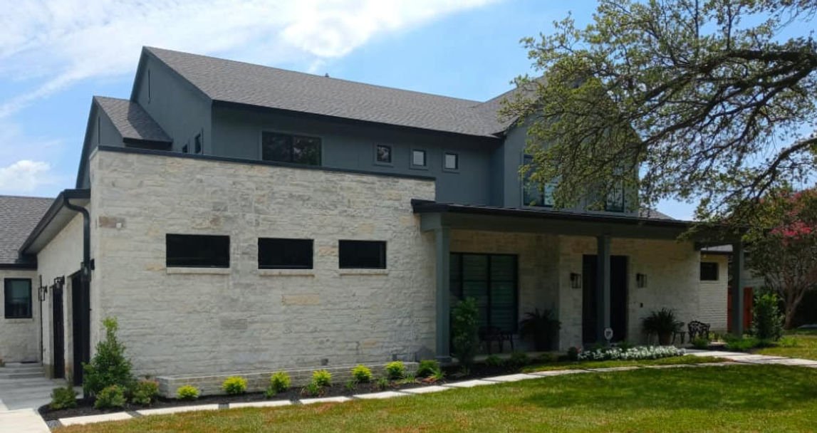 Front exterior of 14342 Valley Hi Cir custom home overlooking the Champions Golf Course in Farmers Branch, Texas