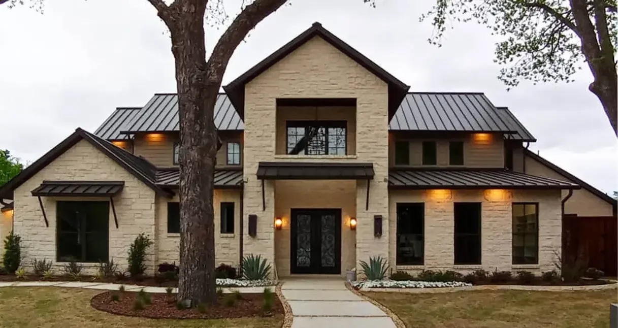 Front exterior of 13628 Braemar Cir Hill Country-style custom home in Farmers Branch, Texas
