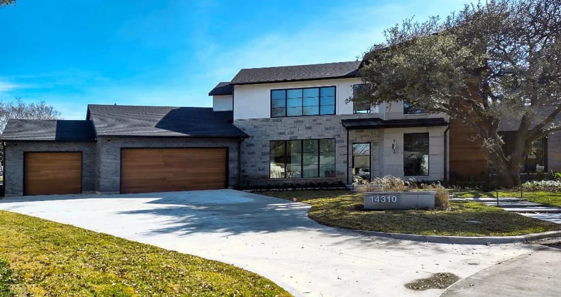 Front exterior of 14310 Valley Hi Cir custom home overlooking Brookhaven Country Club in Farmers Branch, Texas