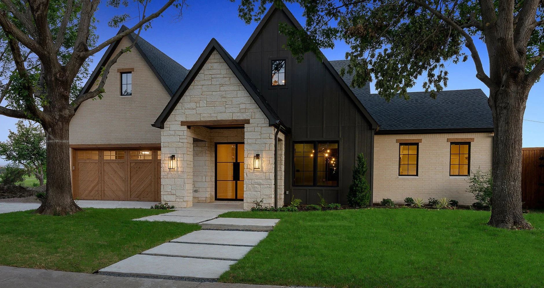 Front exterior of 14240 Coral Harbour Ct custom home near Brookhaven Country Club in Farmers Branch, Texas