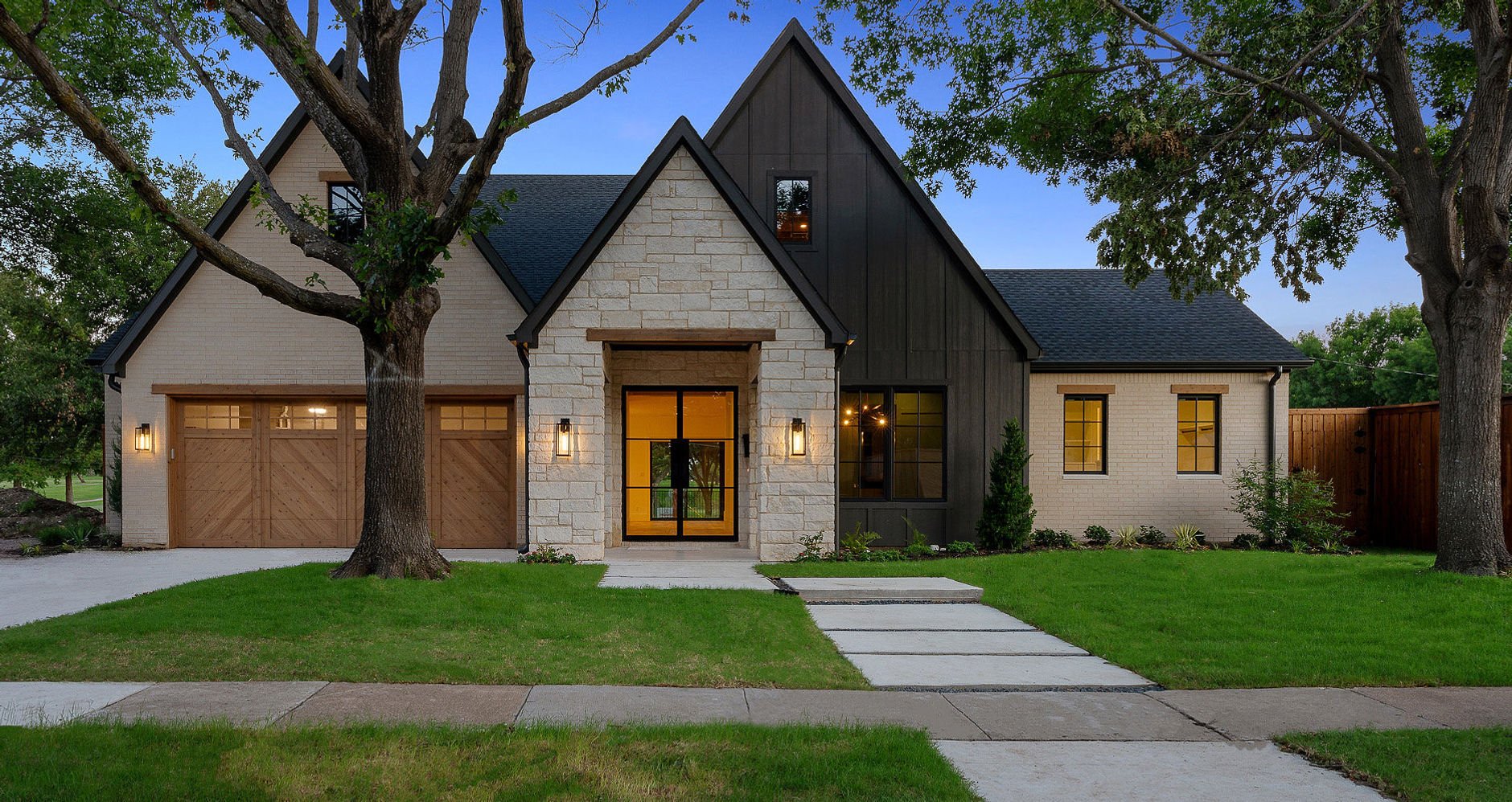 Front and garage elevation of 14240 Coral Harbour Ct custom home in Farmers Branch, Texas
