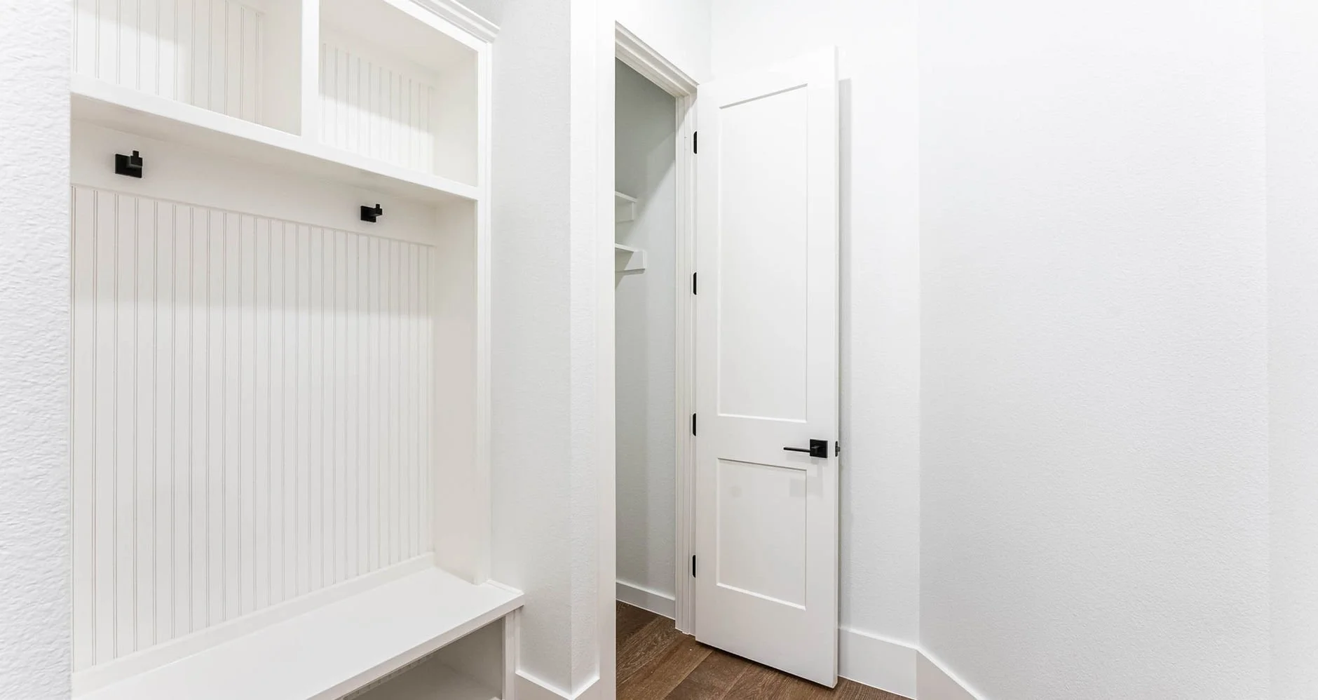 Mudroom entry with built-in storage at 3121 Pebble Beach Dr custom home in Farmers Branch, Texas