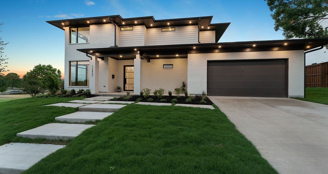 Street-side view of 13807 Lillard Ln two-story custom home in Farmers Branch, Texas