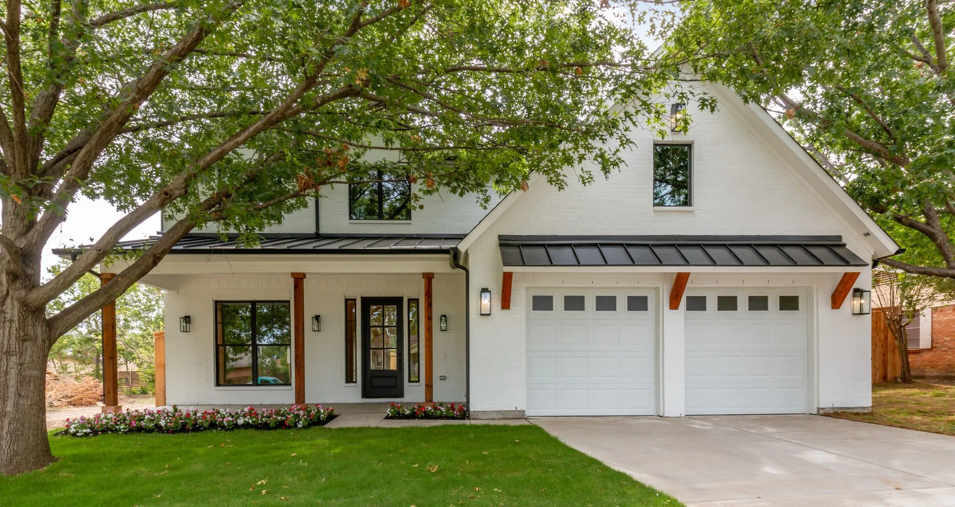 Front entry and garage of 13811 Lillard Ln modern farmhouse custom home in Farmers Branch, Texas