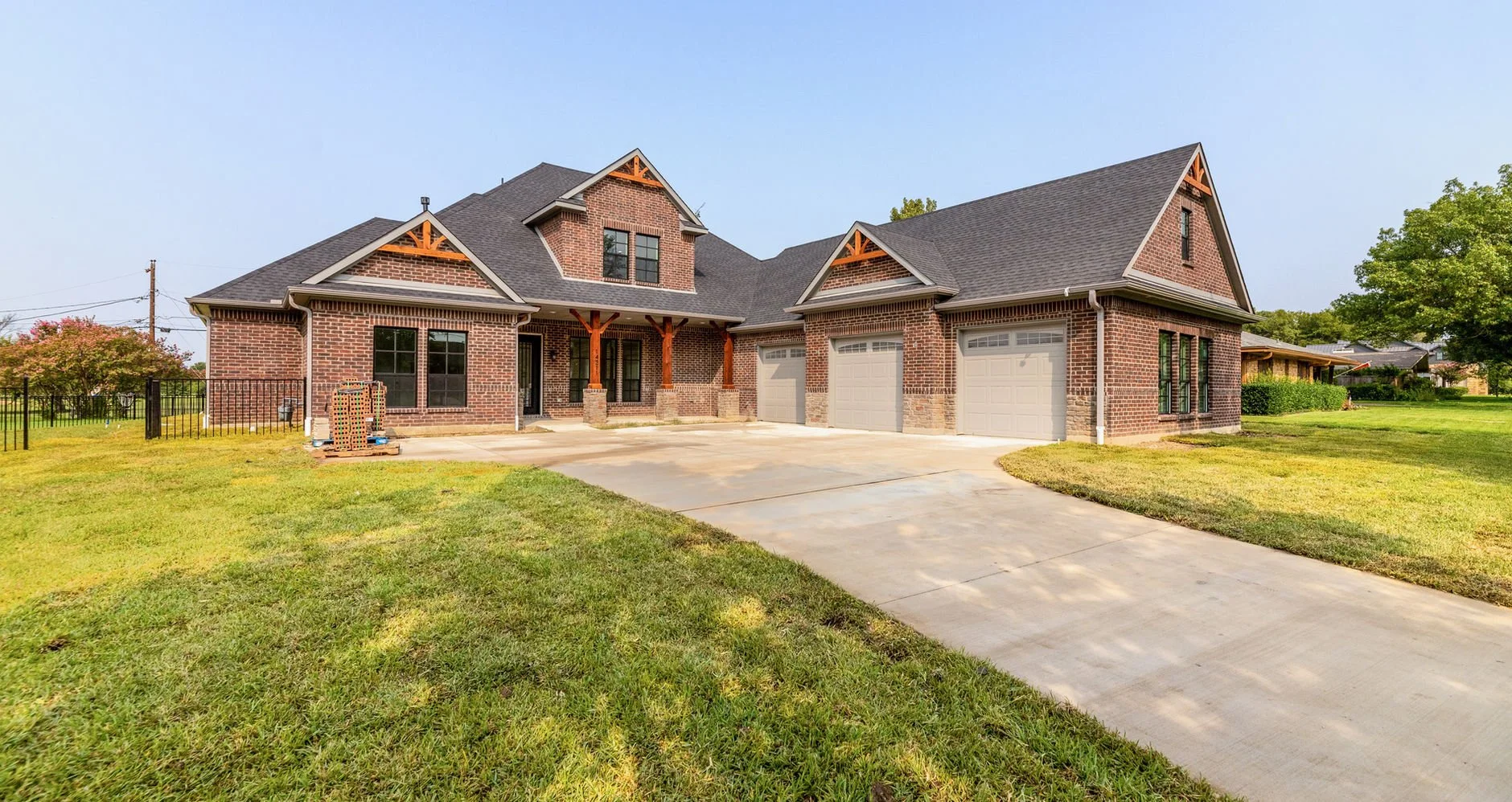 Traditional brick front exterior of 14311 Tanglewood Dr custom home in Farmers Branch, Texas