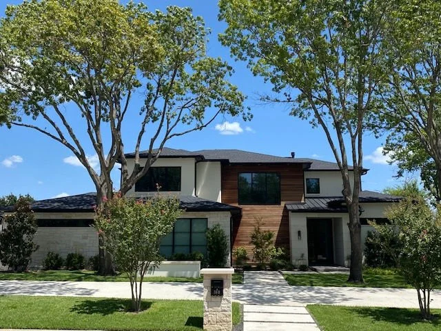 Front exterior of 3441 Golfing Green Dr custom home in Farmers Branch, Texas
