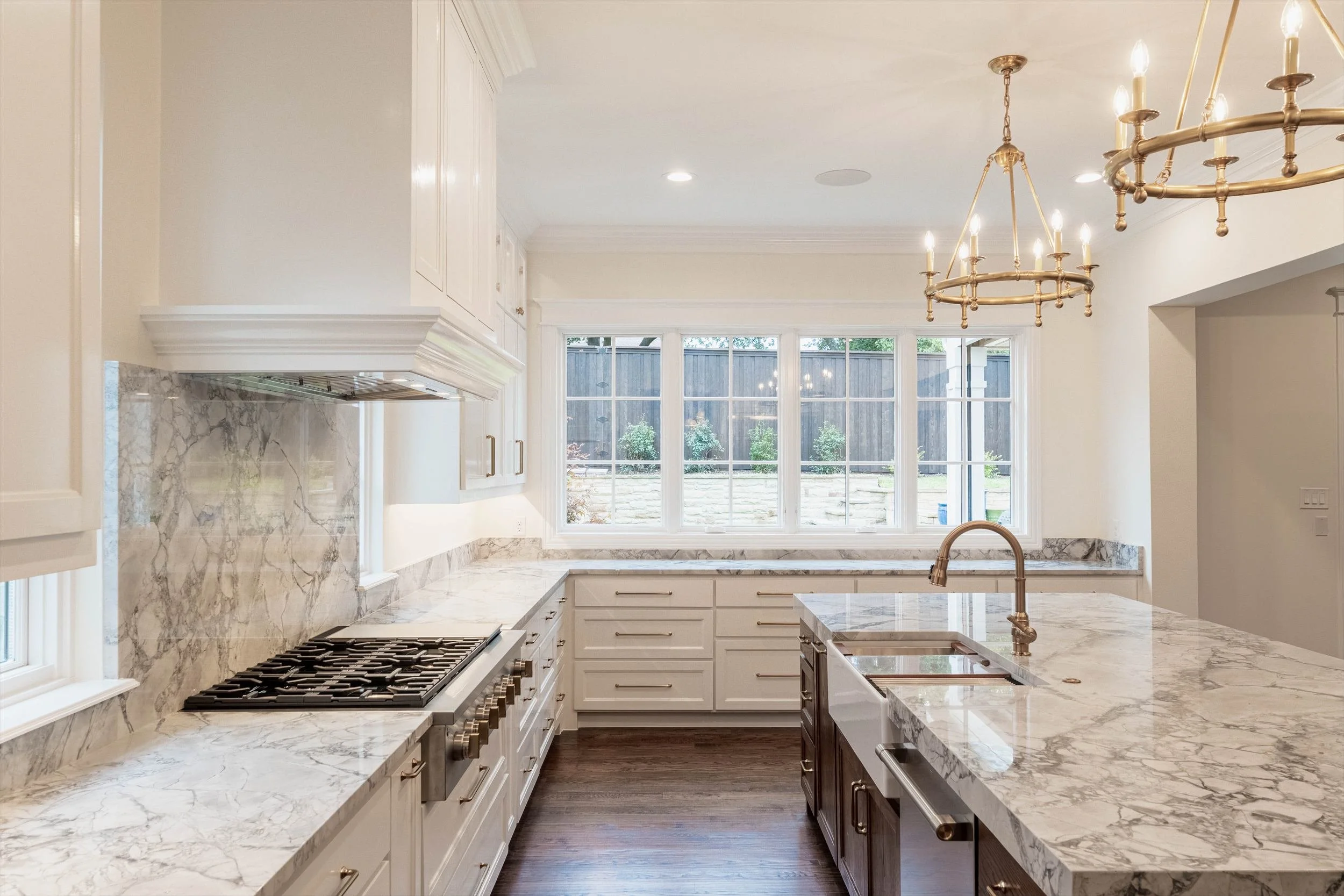 Kitchen with a marble island and professional-style range at 1095 Lathrop Dr.