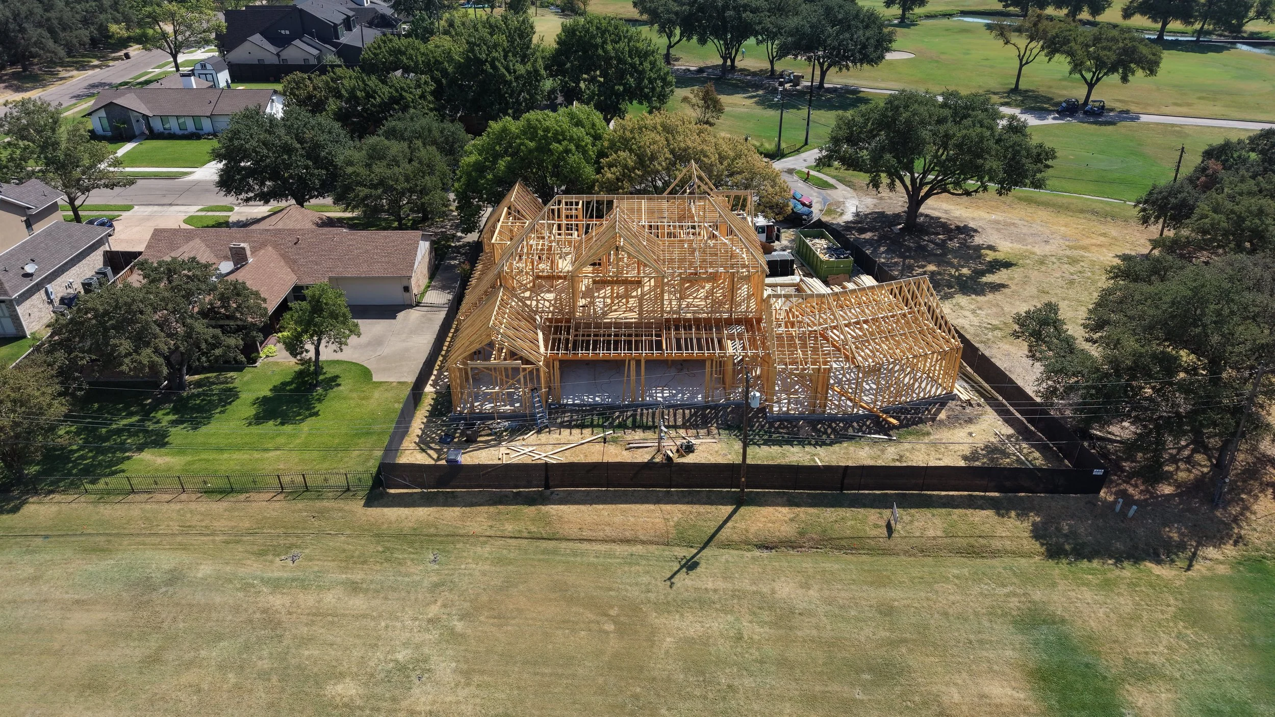 Rear aerial view of timber framing and roof trusses at 14211 Coral Harbour Cir