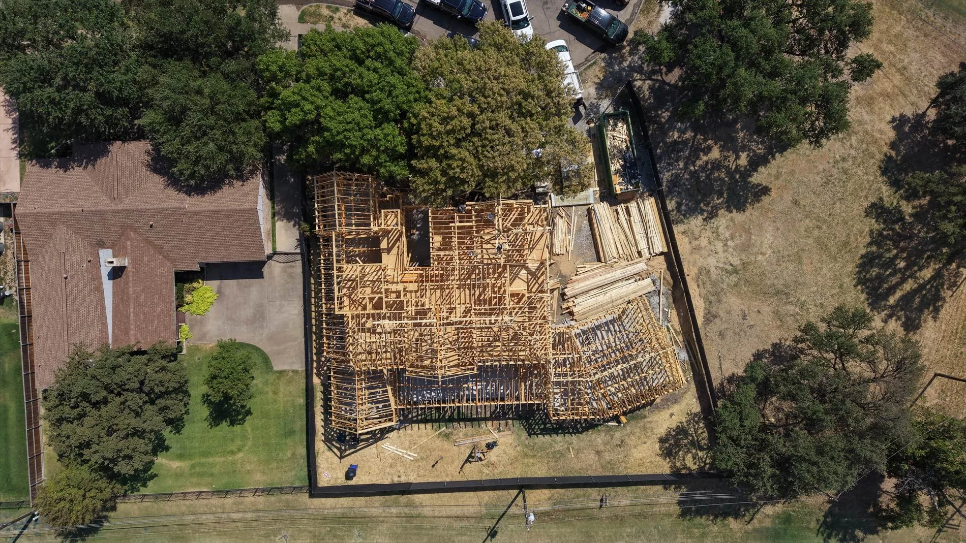 Overhead view of the framed home and trees at 14211 Coral Harbour Cir