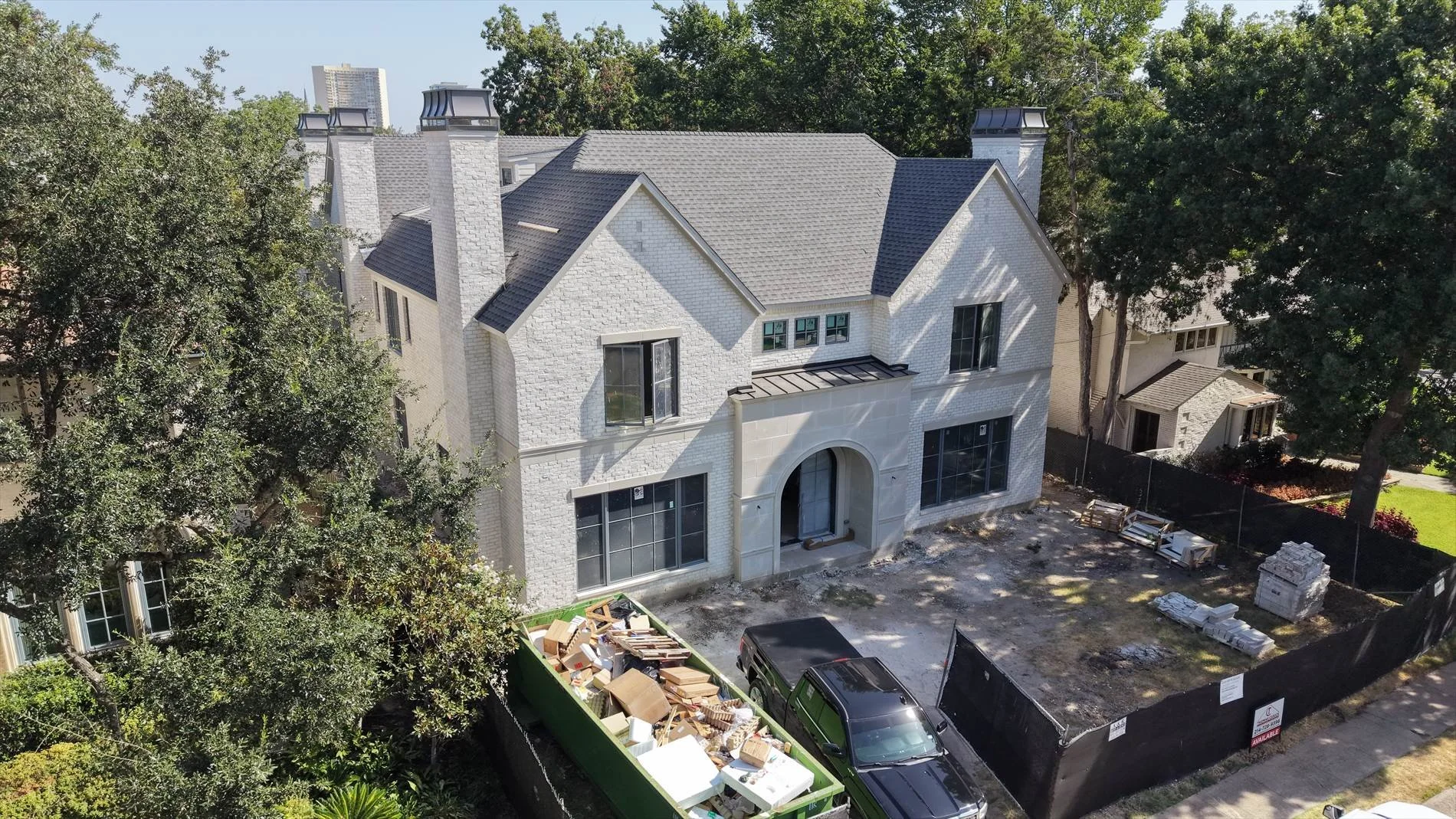 Angled view of the front exterior and construction site at 4004 Bryn Mawr Dr in Dallas, Texas.