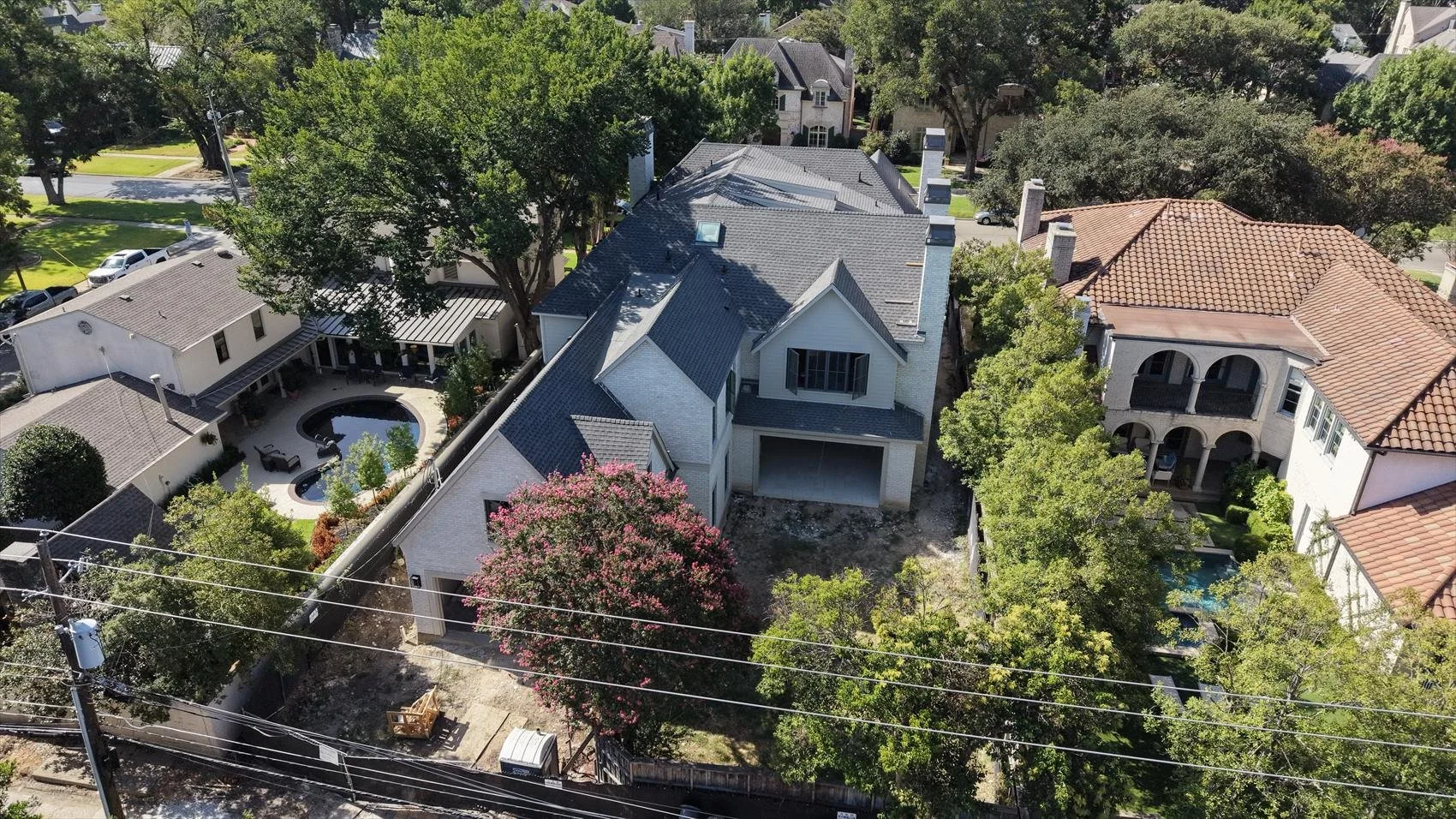 Aerial view of the modern French home under construction at 4004 Bryn Mawr Dr in Dallas, Texas.